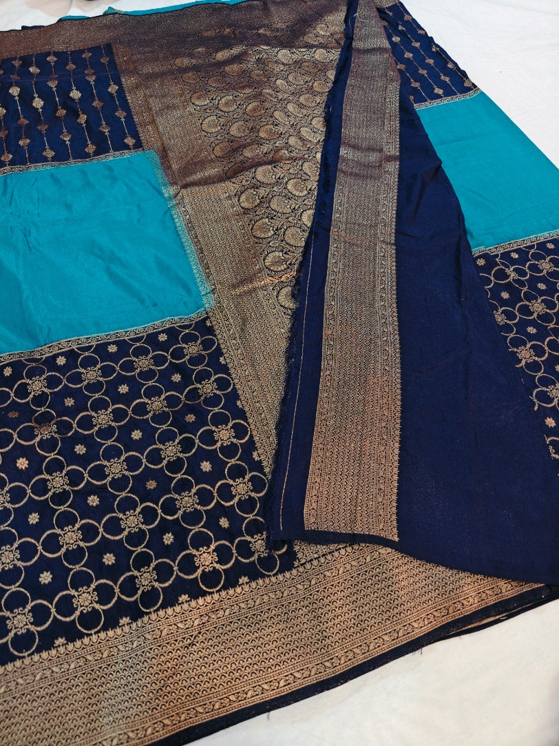 KHADDI GEORGETTE IN THREE TIERRED PATTERN IN NAVY BLUE WITH SKY BLUE