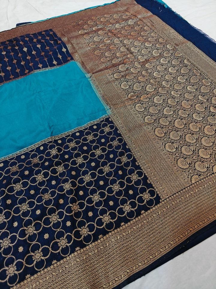 KHADDI GEORGETTE IN THREE TIERRED PATTERN IN NAVY BLUE WITH SKY BLUE