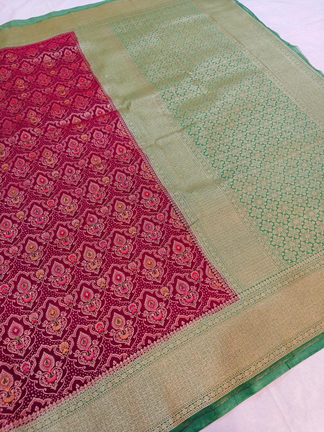 KHADDI GEORGETTE IN GARNET MULTICOLOUR DESIGN WITH PARROT GREEN BORDER