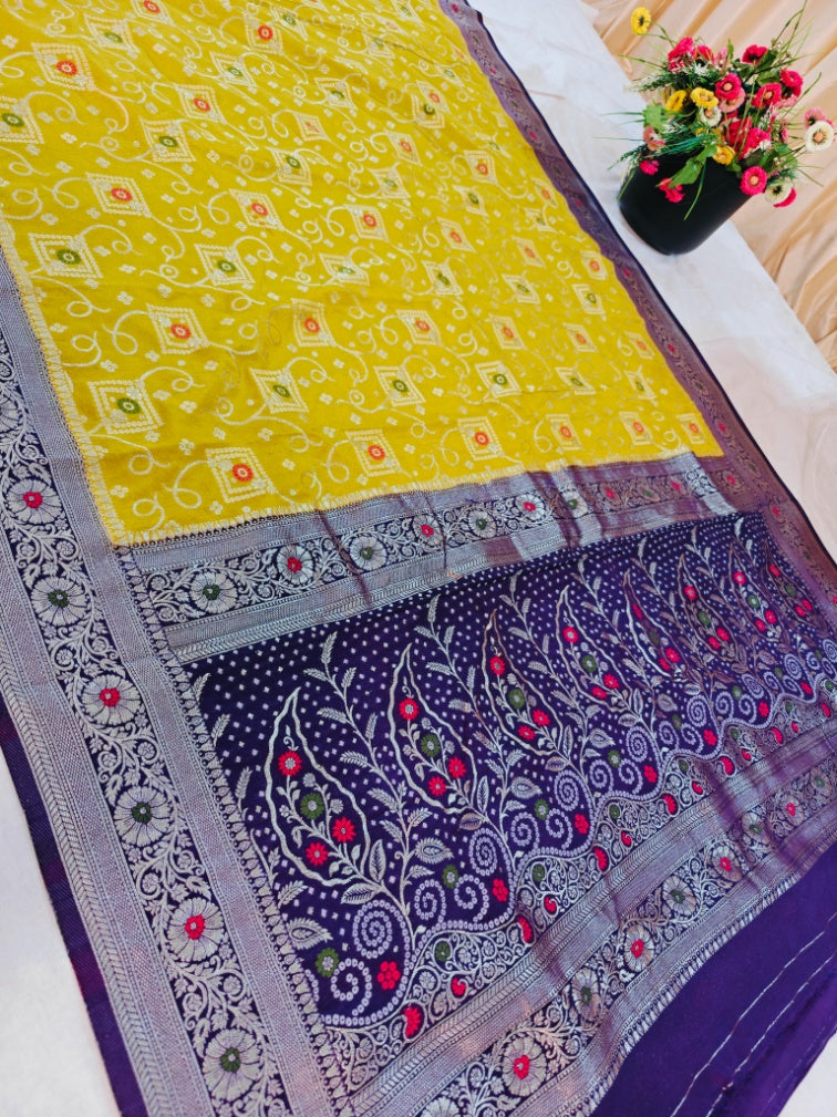 KHADDI GEORGETTE IN GOLD AND VIOLET COLOUR BORDER