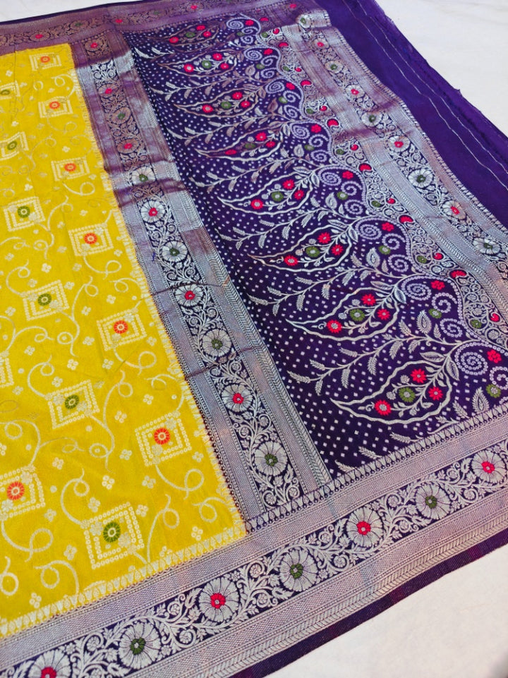 KHADDI GEORGETTE IN GOLD AND VIOLET COLOUR BORDER