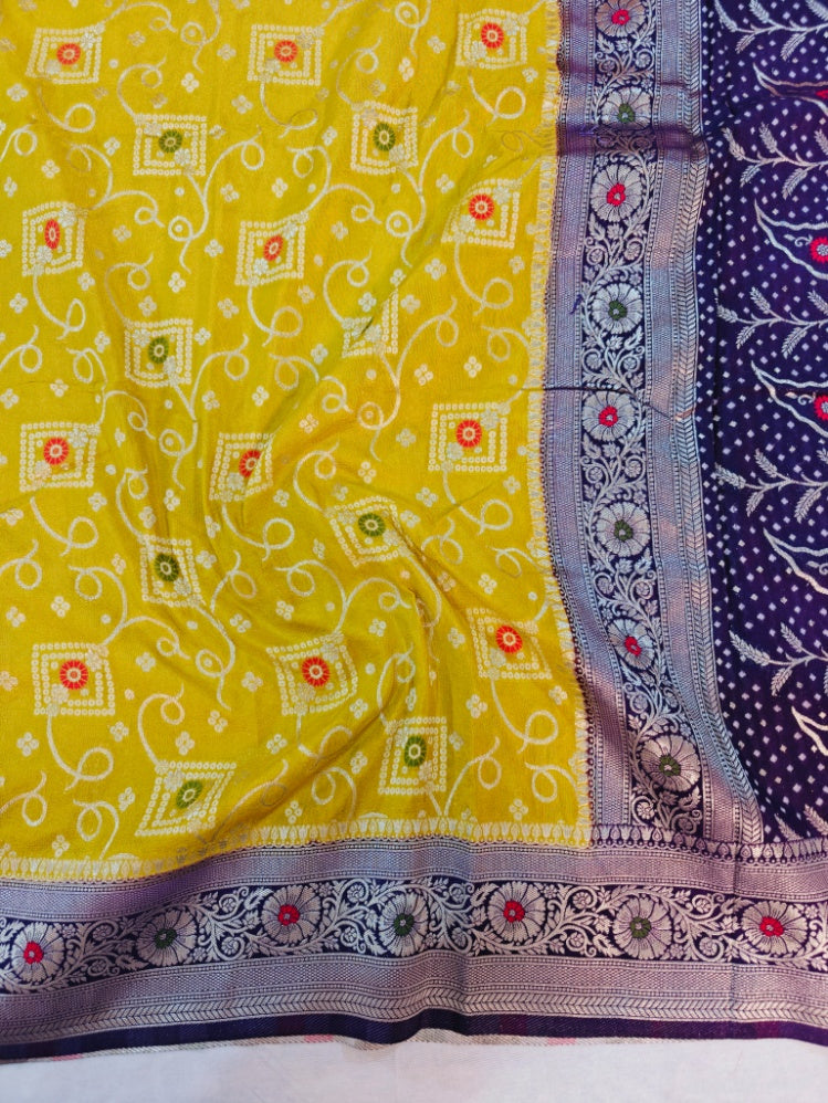 KHADDI GEORGETTE IN GOLD AND VIOLET COLOUR BORDER