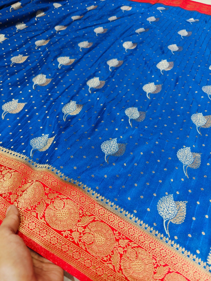 ROYAL BLUE KHADDI GEORGETTE WITH RED BORDER