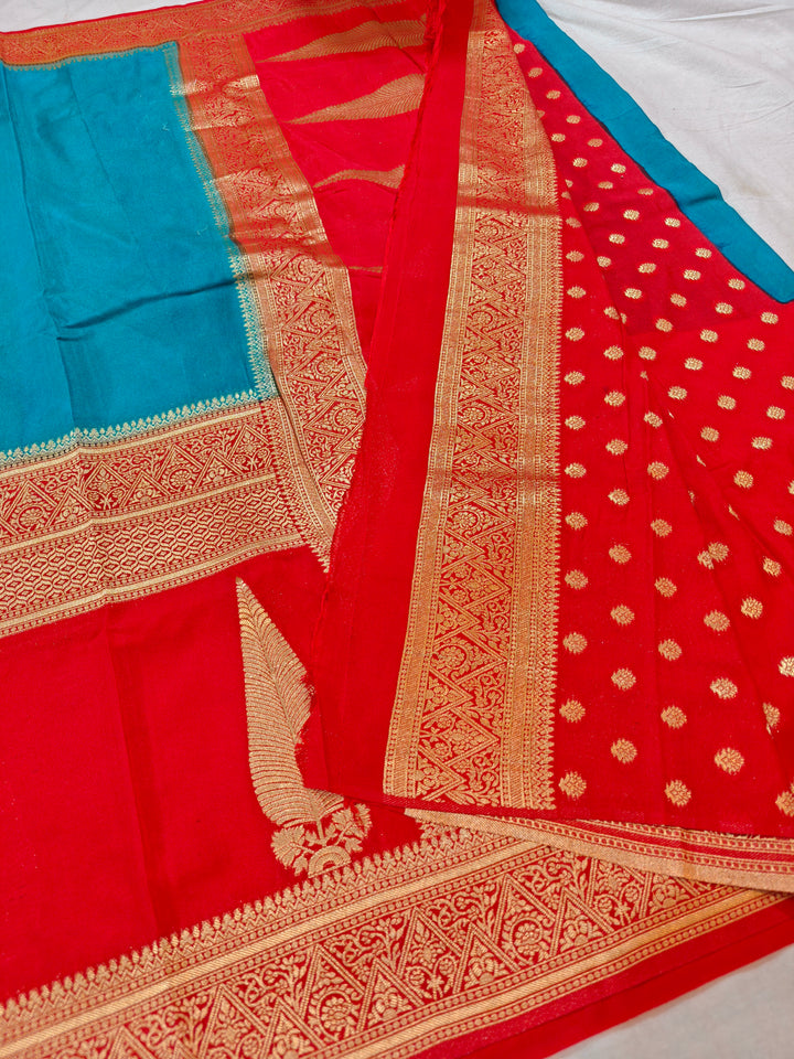 TORQUOISE BLUE KHADDI GEORGETTE WITH KAIRI BOOTA ON RED BORDER
