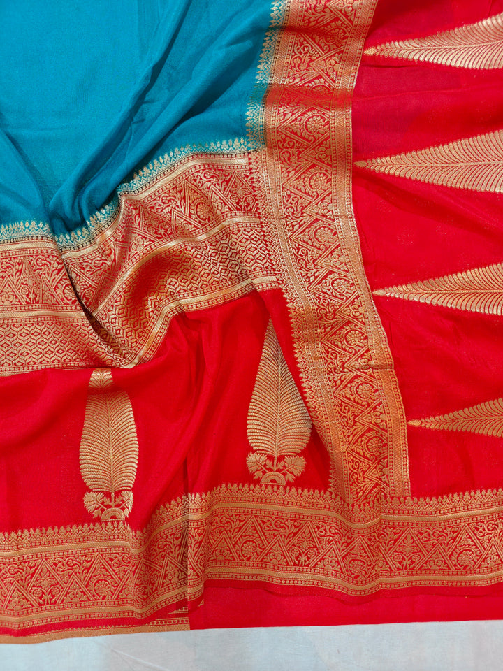 TORQUOISE BLUE KHADDI GEORGETTE WITH KAIRI BOOTA ON RED BORDER