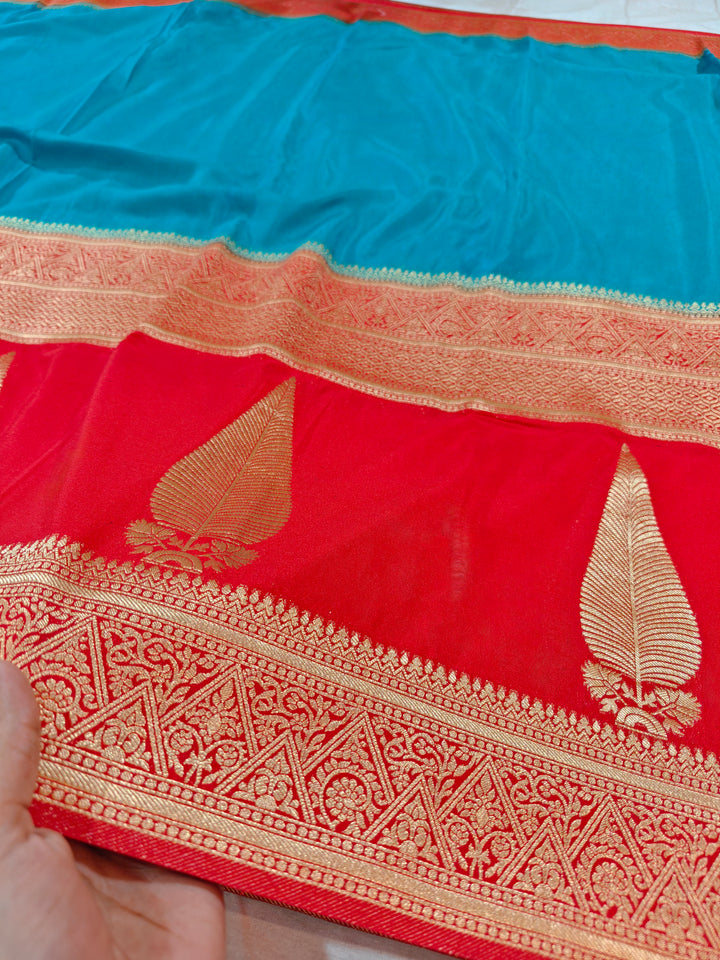 TORQUOISE BLUE KHADDI GEORGETTE WITH KAIRI BOOTA ON RED BORDER