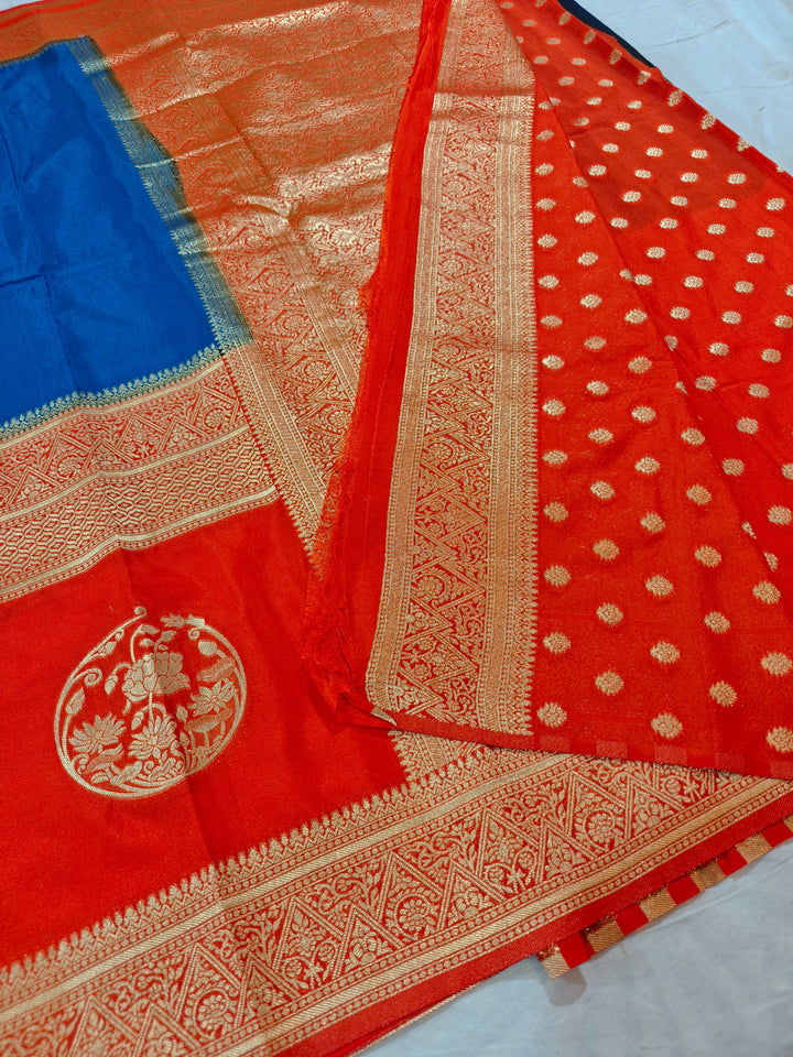 ROYAL BLUE KHADDI GEORGETTE WITH ORANGE BORDER