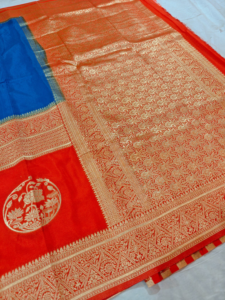 ROYAL BLUE KHADDI GEORGETTE WITH ORANGE BORDER