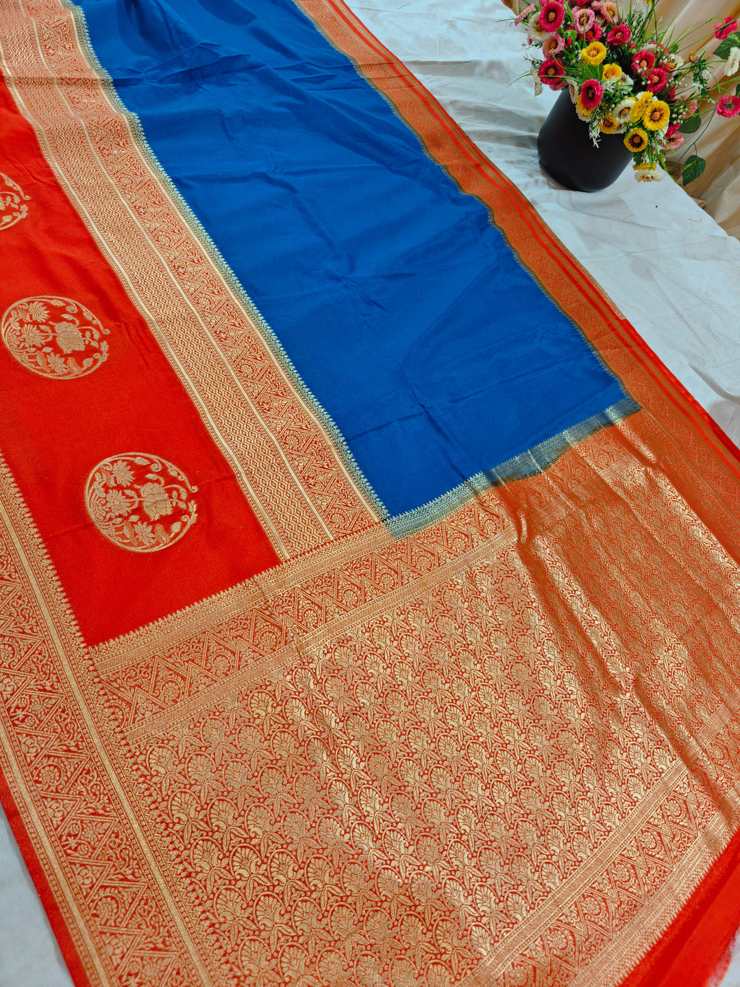ROYAL BLUE KHADDI GEORGETTE WITH ORANGE BORDER