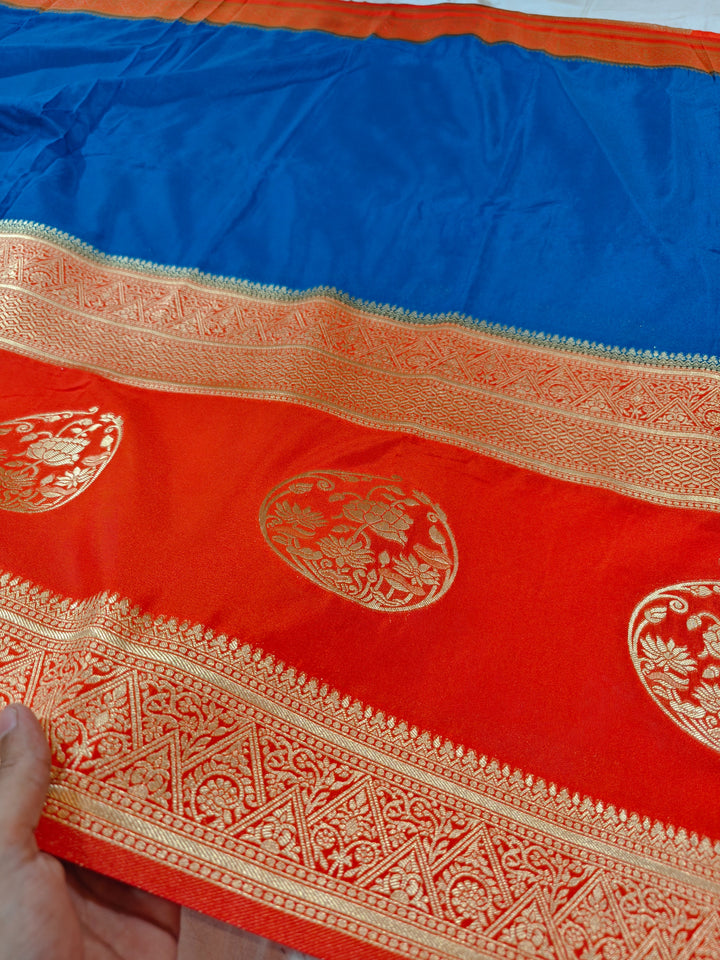 ROYAL BLUE KHADDI GEORGETTE WITH ORANGE BORDER