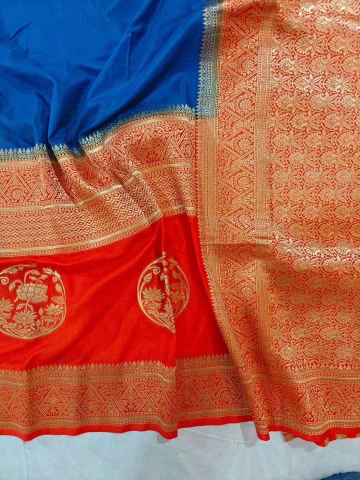 ROYAL BLUE KHADDI GEORGETTE WITH ORANGE BORDER