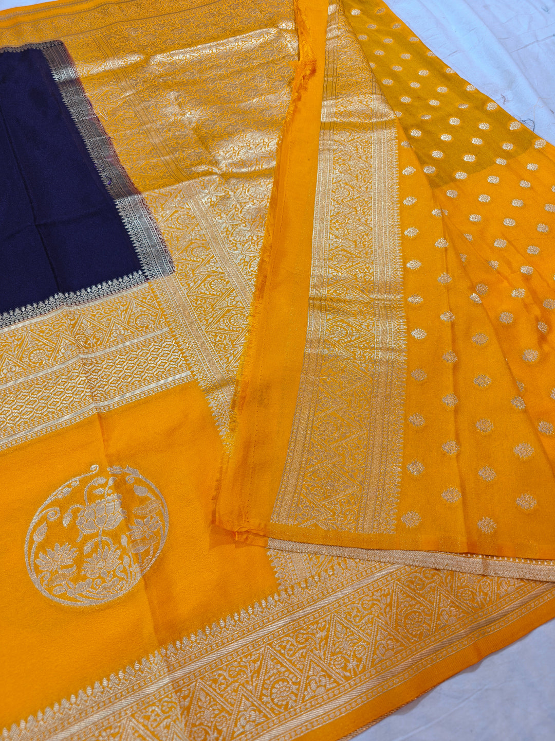 NAVY BLUE KHADDI GEORGETTE WITH GOLD BORDER