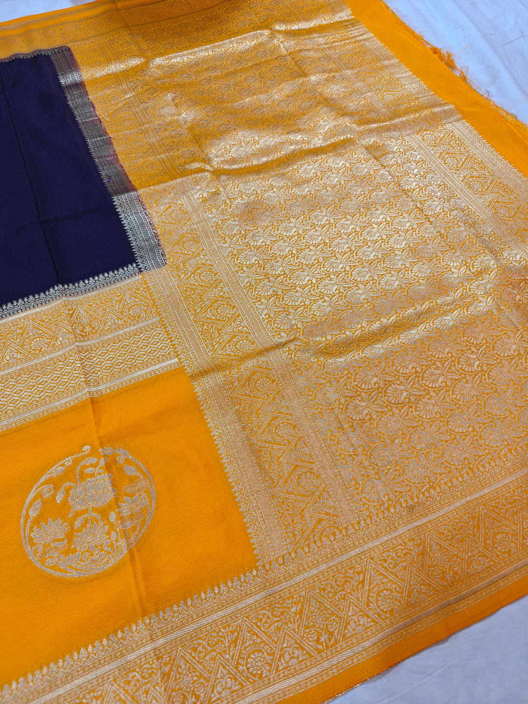 NAVY BLUE KHADDI GEORGETTE WITH GOLD BORDER