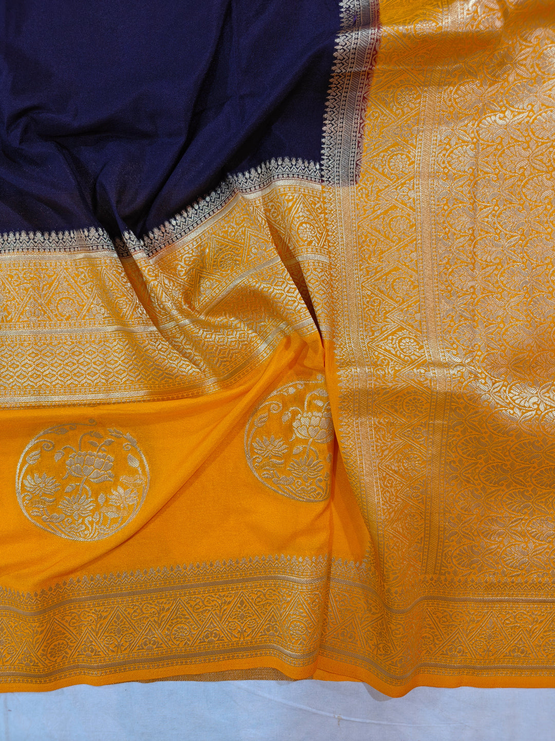 NAVY BLUE KHADDI GEORGETTE WITH GOLD BORDER