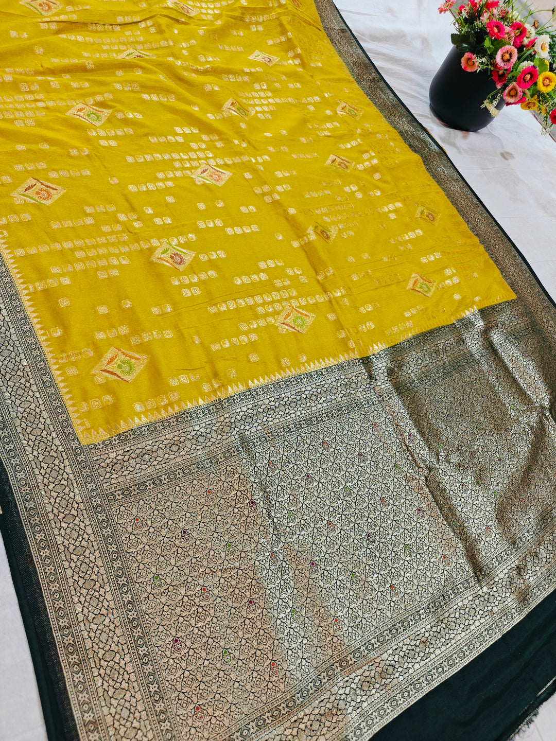 YELLOW KHADDI GEORGETTE WITH BOTTLE GREEN BORDER