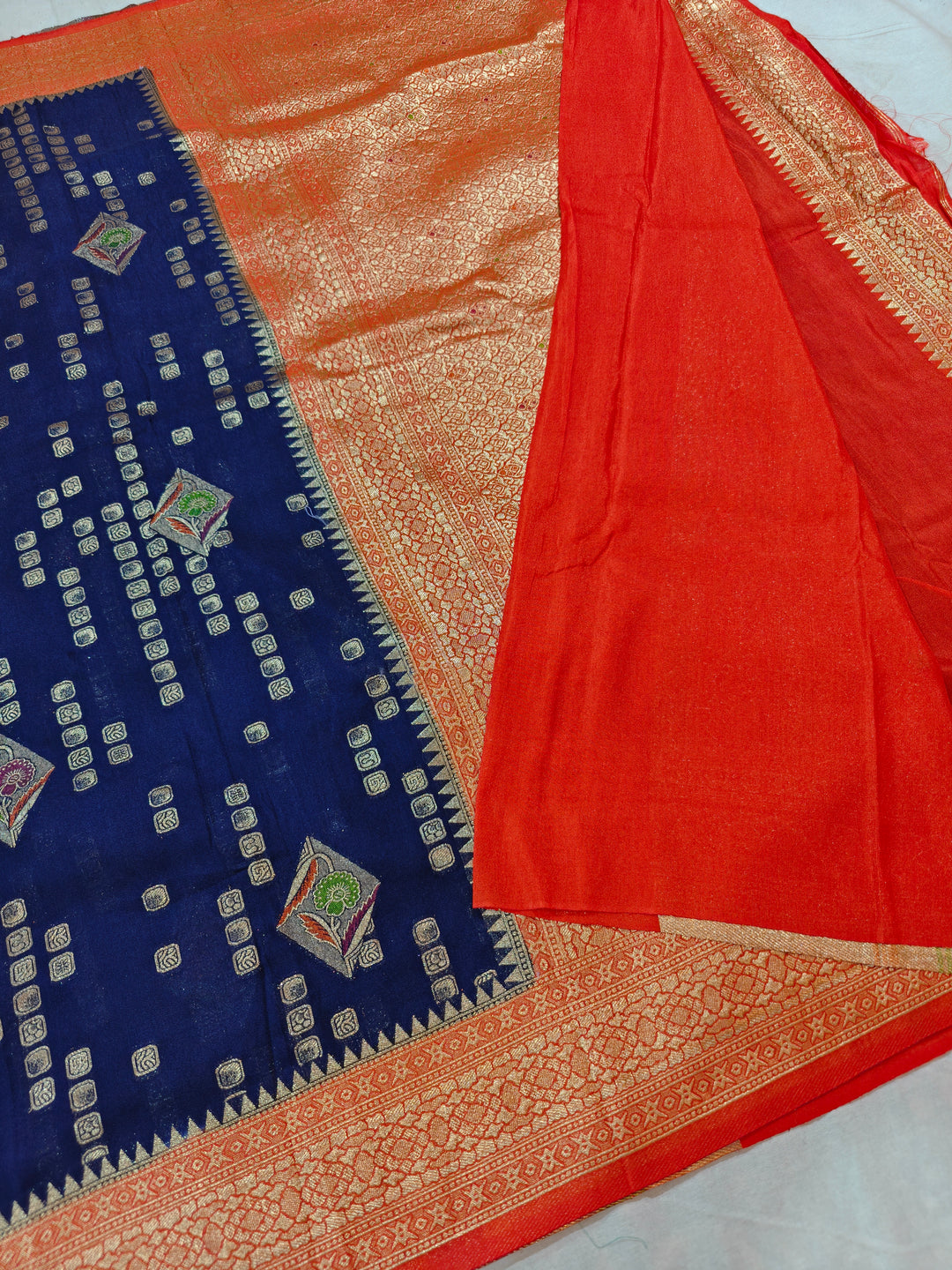 NAVY BLUE KHADDI GEORGETTE WITH RED BORDER