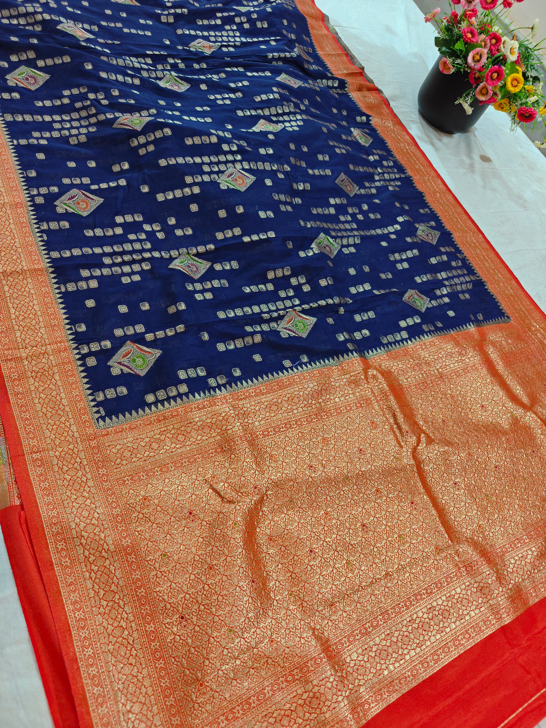 NAVY BLUE KHADDI GEORGETTE WITH RED BORDER