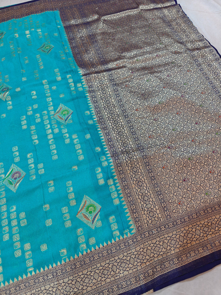 ICE BLUE KHADDI GEORGETTE WITH NAVY BLUE BORDER