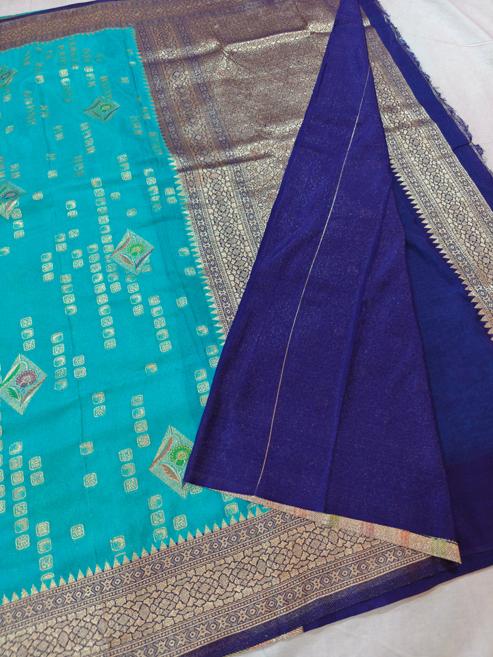 ICE BLUE KHADDI GEORGETTE WITH NAVY BLUE BORDER