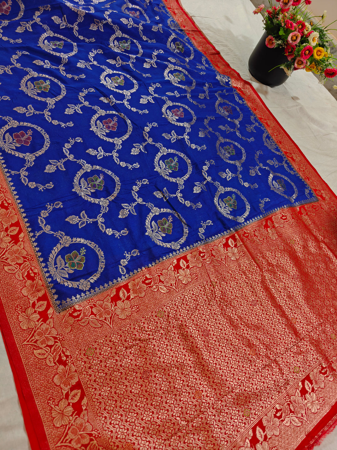 KHADDI GEORGETTE IN ROYAL BLUE WITH RED BORDER