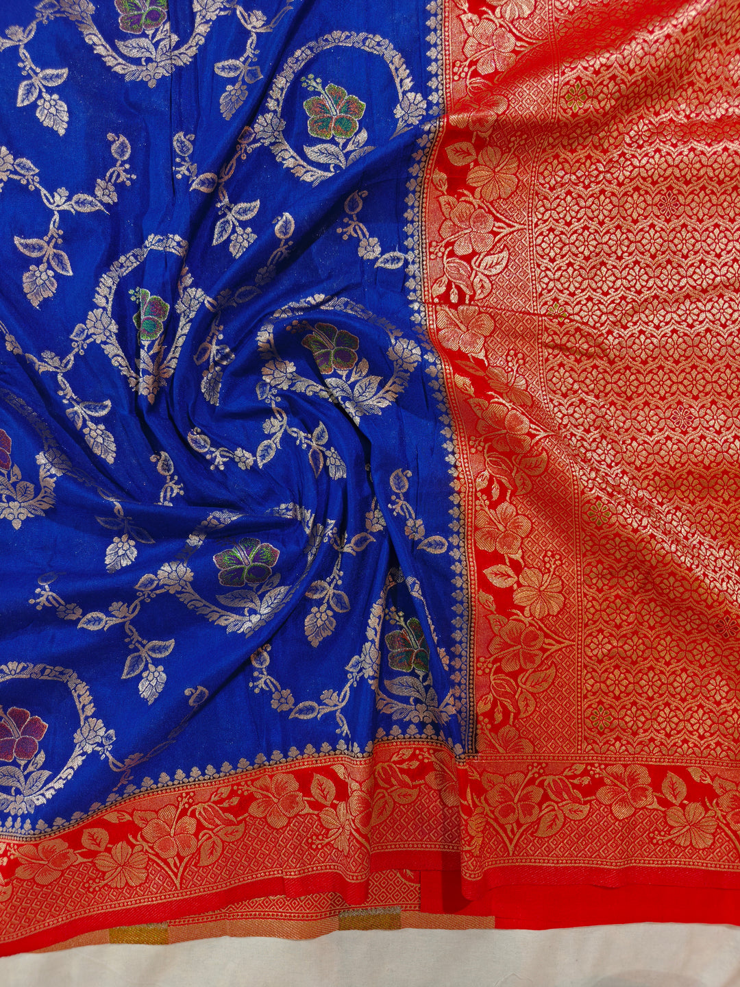 KHADDI GEORGETTE IN ROYAL BLUE WITH RED BORDER
