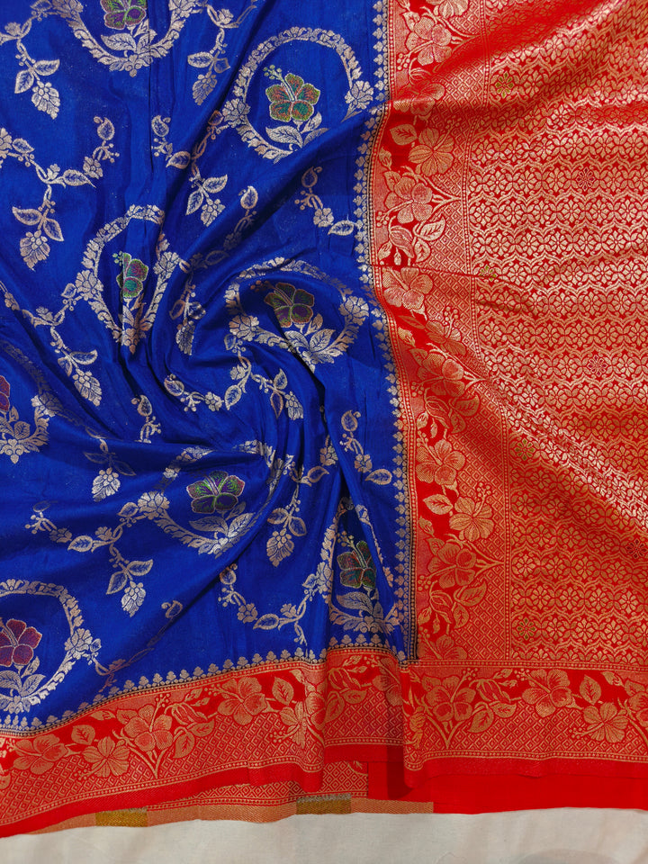 KHADDI GEORGETTE IN ROYAL BLUE WITH RED BORDER