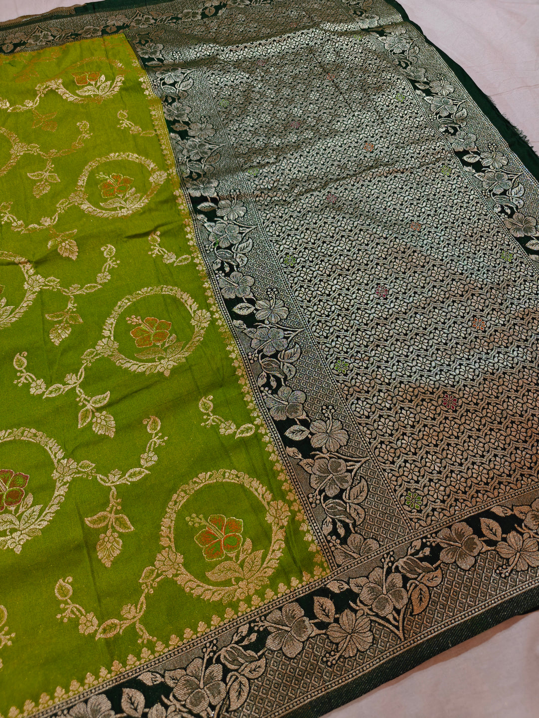 KHADDI GEORGETTE IN PARROT GREEN WITH BOTTLE GREEN BORDER