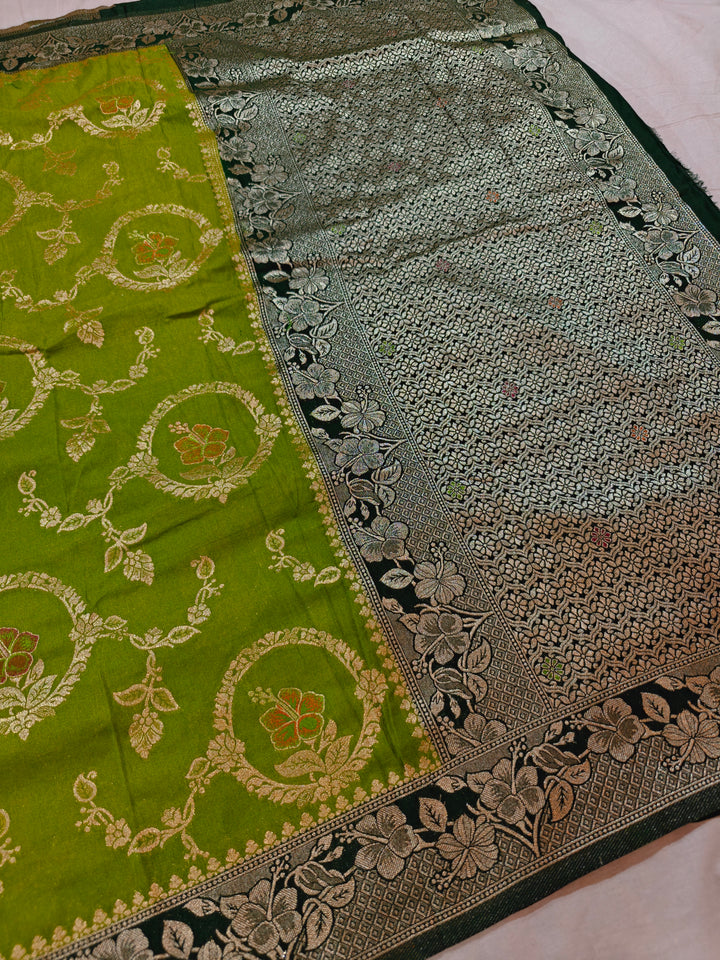 KHADDI GEORGETTE IN PARROT GREEN WITH BOTTLE GREEN BORDER