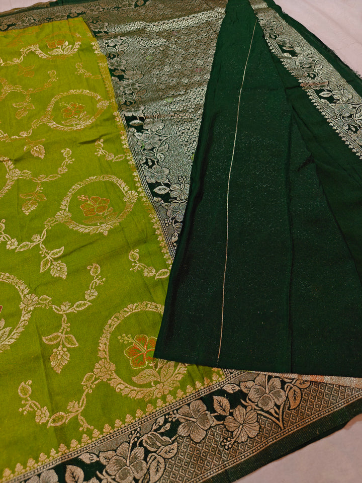 KHADDI GEORGETTE IN PARROT GREEN WITH BOTTLE GREEN BORDER