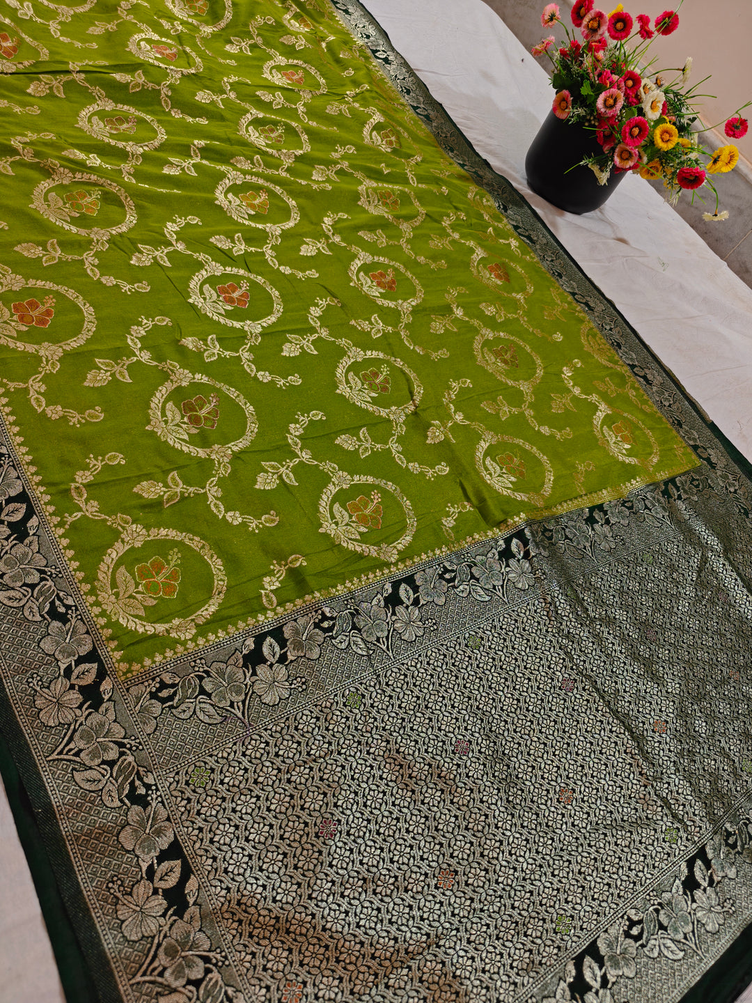 KHADDI GEORGETTE IN PARROT GREEN WITH BOTTLE GREEN BORDER