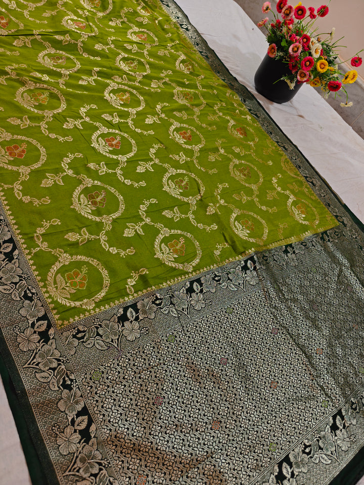 KHADDI GEORGETTE IN PARROT GREEN WITH BOTTLE GREEN BORDER