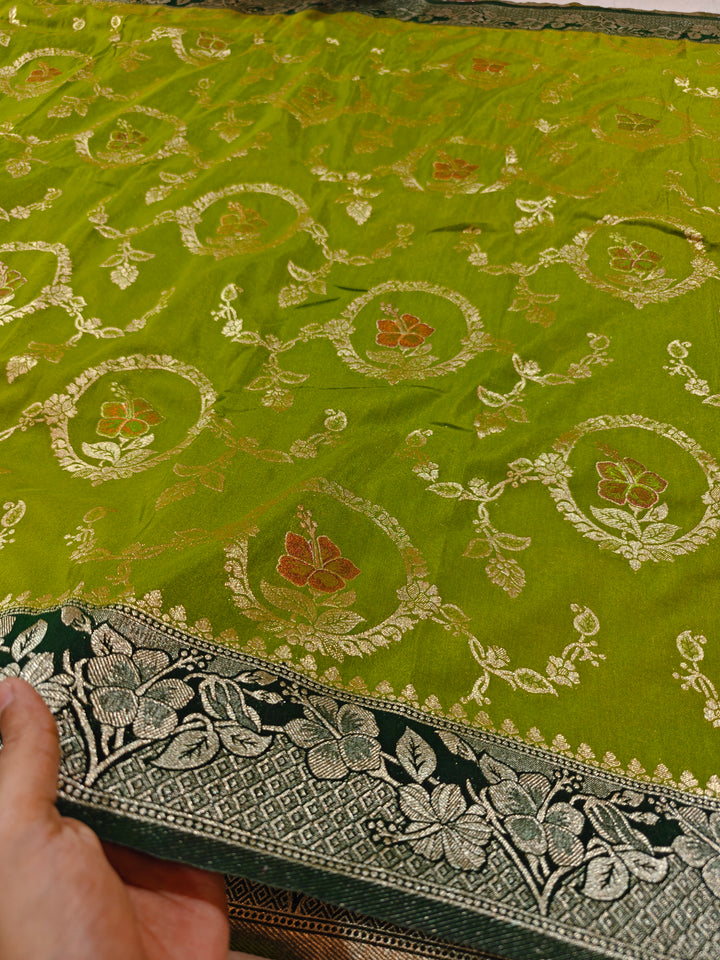 KHADDI GEORGETTE IN PARROT GREEN WITH BOTTLE GREEN BORDER