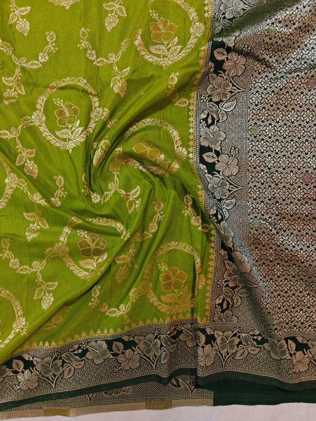 KHADDI GEORGETTE IN PARROT GREEN WITH BOTTLE GREEN BORDER