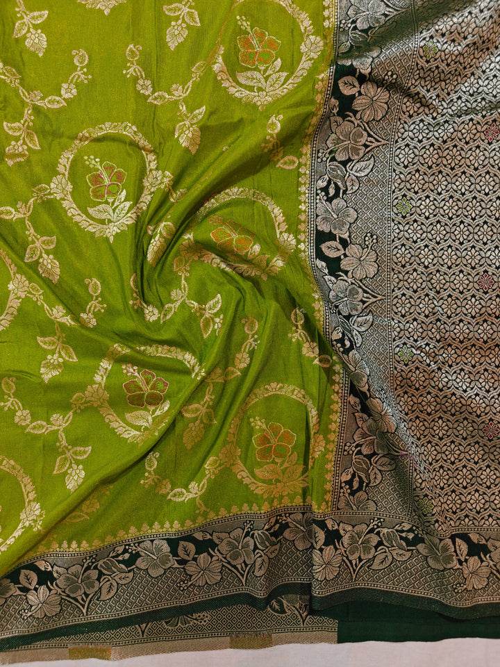 KHADDI GEORGETTE IN PARROT GREEN WITH BOTTLE GREEN BORDER