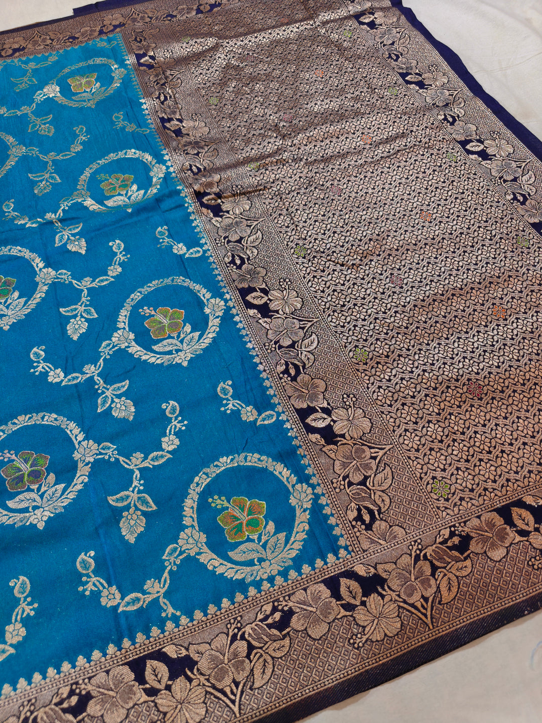 KHADDI GEORGETTE IN OCEAN BLUE WITH NAVY BLUE BORDER