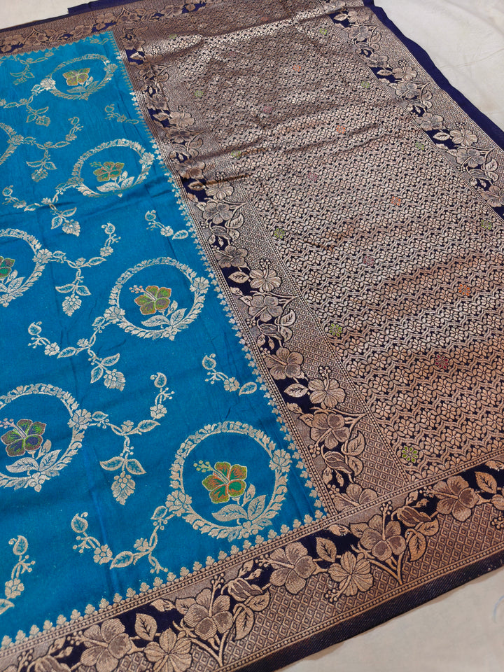 KHADDI GEORGETTE IN OCEAN BLUE WITH NAVY BLUE BORDER