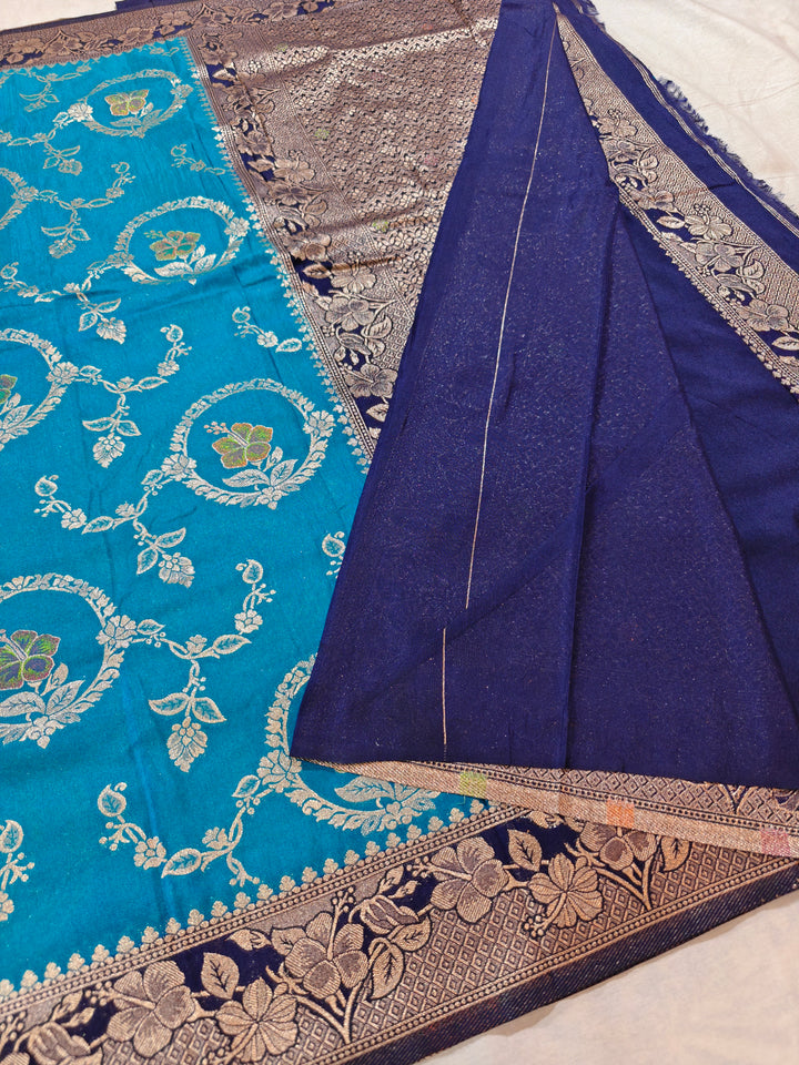 KHADDI GEORGETTE IN OCEAN BLUE WITH NAVY BLUE BORDER