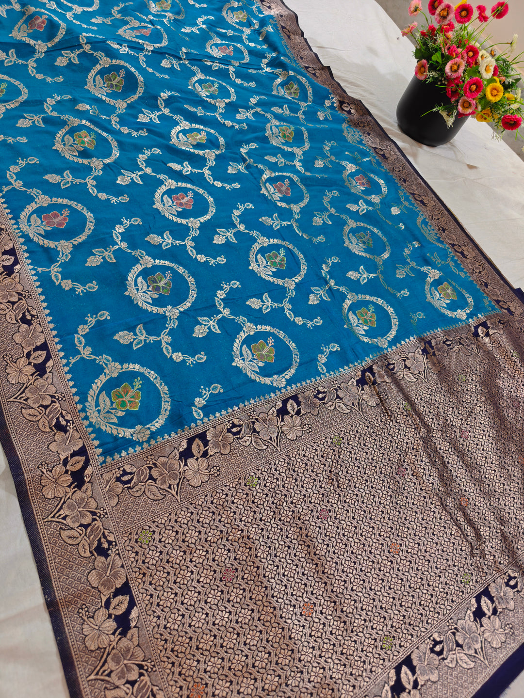 KHADDI GEORGETTE IN OCEAN BLUE WITH NAVY BLUE BORDER