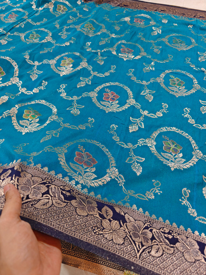 KHADDI GEORGETTE IN OCEAN BLUE WITH NAVY BLUE BORDER