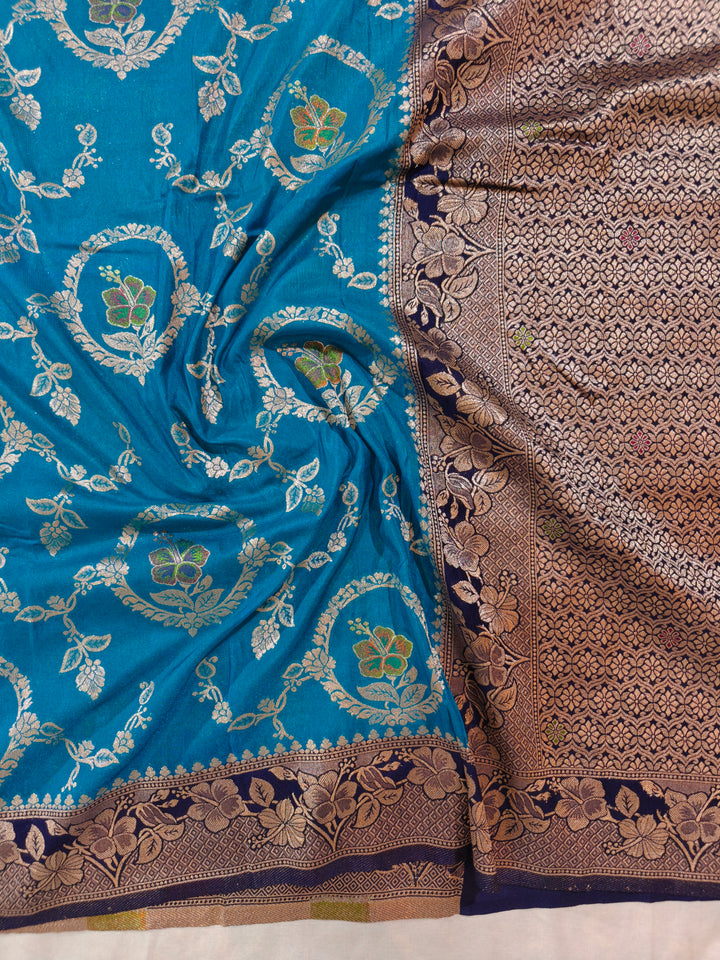 KHADDI GEORGETTE IN OCEAN BLUE WITH NAVY BLUE BORDER