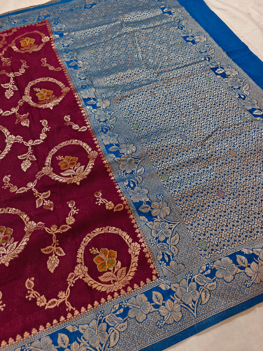 KHADDI GEORGETTE IN GARNET COLOUR WITH ROYAL BLUE BORDER