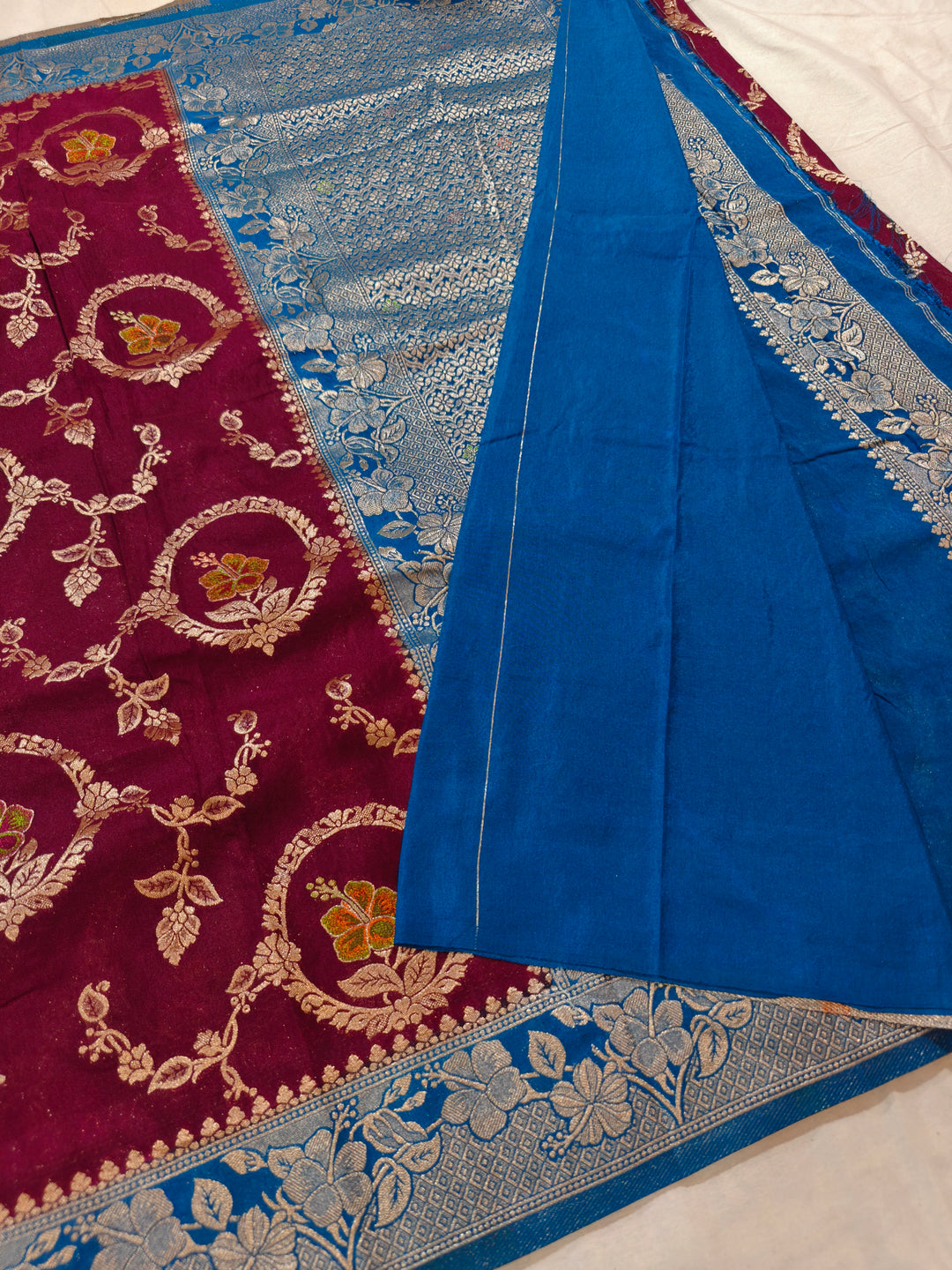 KHADDI GEORGETTE IN GARNET COLOUR WITH ROYAL BLUE BORDER