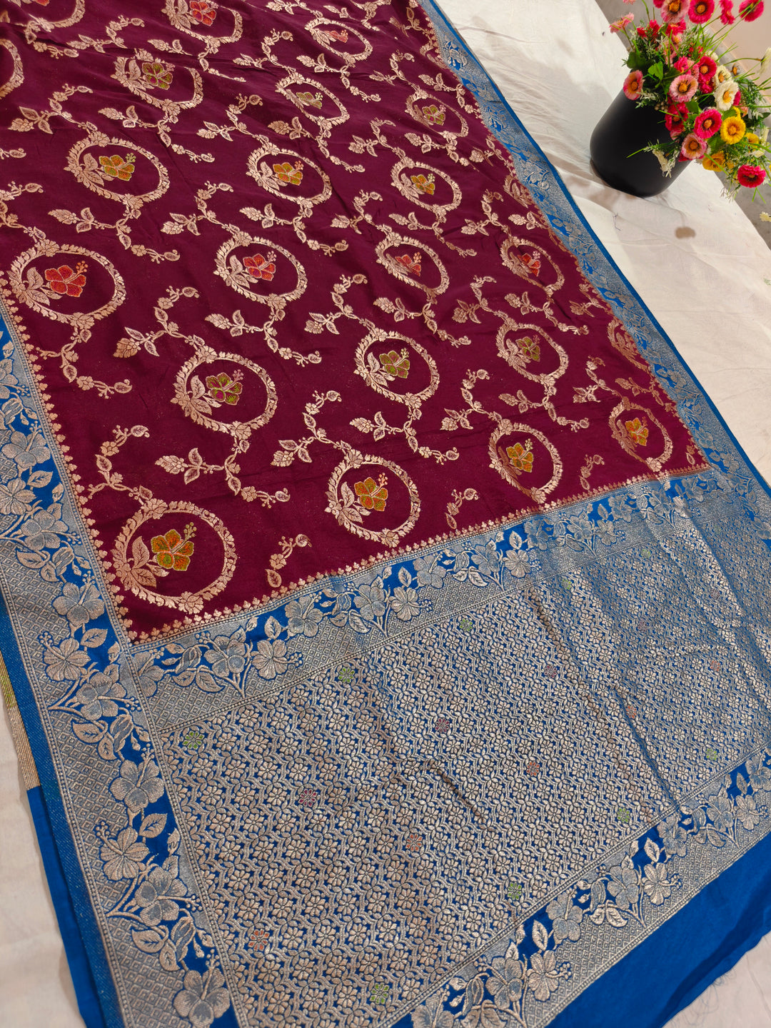 KHADDI GEORGETTE IN GARNET COLOUR WITH ROYAL BLUE BORDER