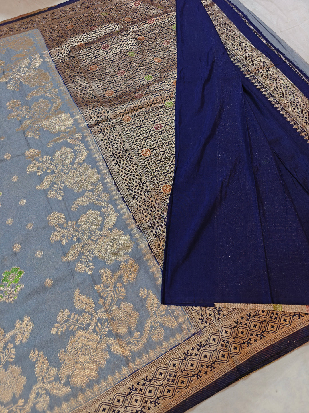 KHADDI GEORGETTE IN GREY WITH NAVY BLUE BORDER