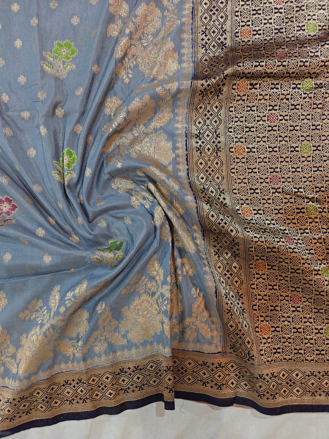 KHADDI GEORGETTE IN GREY WITH NAVY BLUE BORDER